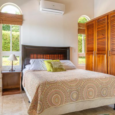 Bedroom #2 has a queen-size be, air conditioning and access to the outdoor patio.