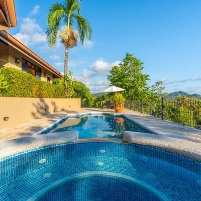 Large swimming pool with smaller plunge pool for sitting and relaxing