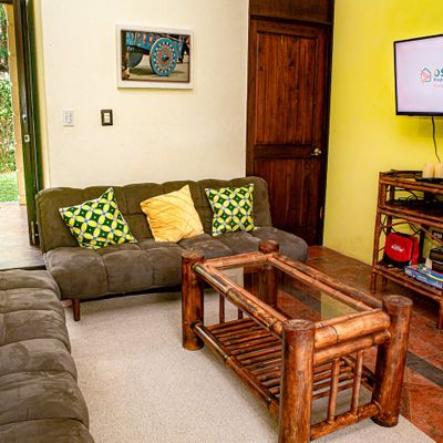 With its grand proportions, this living room offers an inviting space for family time and entertaining guests