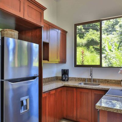 charming and cozy kitchen , designed for warmth and functionality.