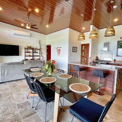 Open floor plan with well equipped kitchen and comfortable living room.