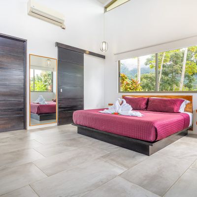 Suite #1 has ocean views, mountain views, access to the private pool, along with en-suite bathroom, air conditioning and ceiling fan.