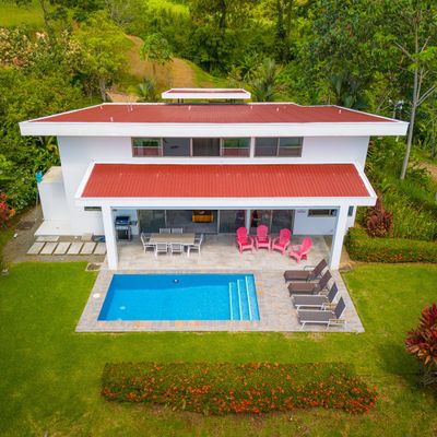 An aerial view of the house, showcasing its beautiful layout and surrounding landscape