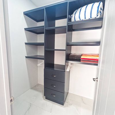 A spacious wardrobe in the master bedroom, offering ample storage and sleek design.