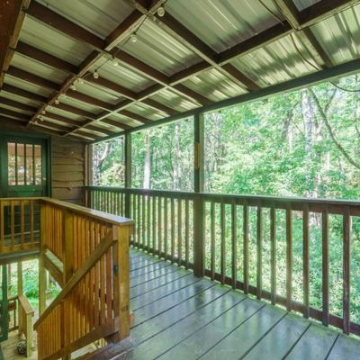 Porch to downstairs rooms and washer/dryer area
