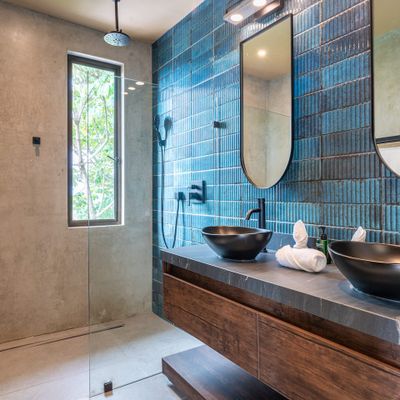 spacious bathroom featuring two stylish sinks, perfect for shared comfort.
