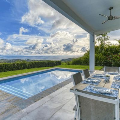 A stunning blend of the sky and pool area, creating a serene and picturesque view.