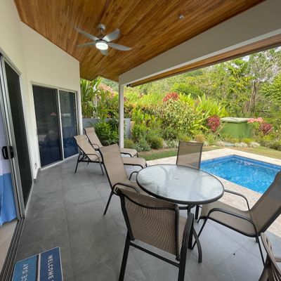 A spacious poolside area, perfect for lounging and enjoying the outdoors.