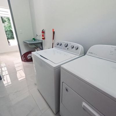 In-home clothes washer and clothes dryer is free to use. Detergent is not provided