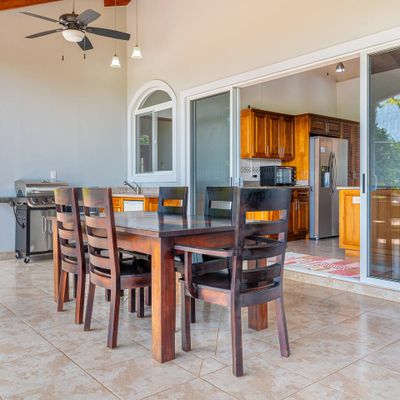 Chairs and a table perfect for outdoor dining by the pool