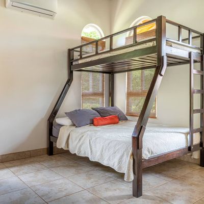 well-designed room with a bunk bed, ideal for maximizing space.