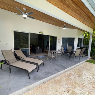 Crystal-clear swimming pool with lounge chairs for relaxation.