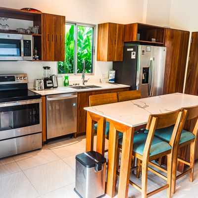 A bright and stylish kitchen with modern cabinetry and a spacious island.