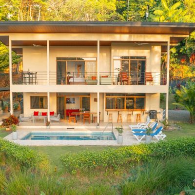 A stunning front  with elegant architecture and beautifully landscaped surroundings.