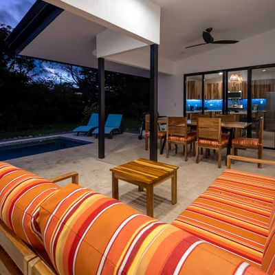 bright living room overlooking the serene pool area