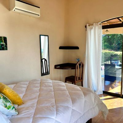 Bedroom #2 has A/C, corner desk, ocean view patio access.