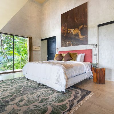 Owner's Suite has large en-suite bathroom, king size bed, closet, A/C, access to one of the numerous decks and walkway to the pool.