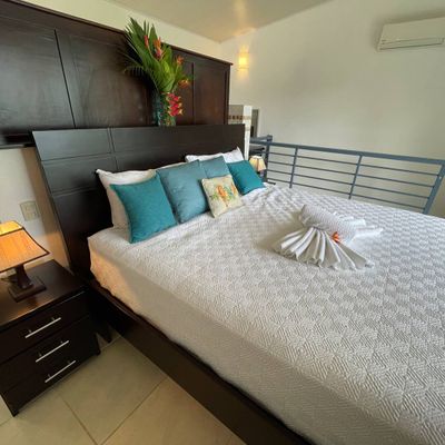 Owner's Suite has king-size bed, en suite bathroom, private balcony.