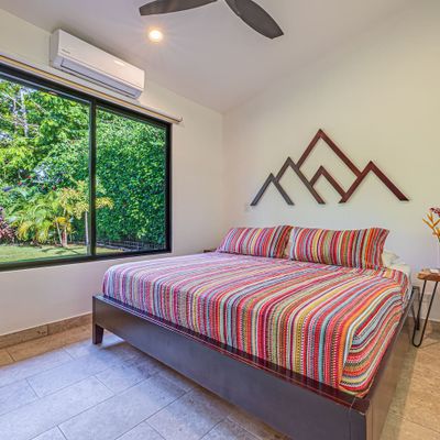 Bedroom 2 has king-size bed, A/C and ceiling fan.