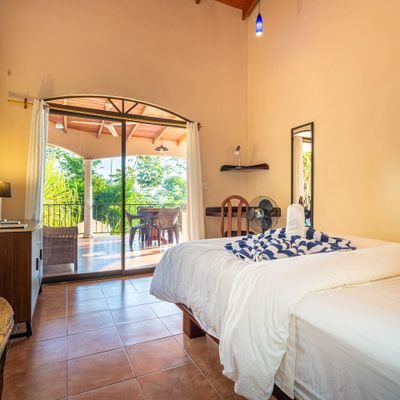 Bedroom #3 has A/C, corner desk, ocean view patio access.