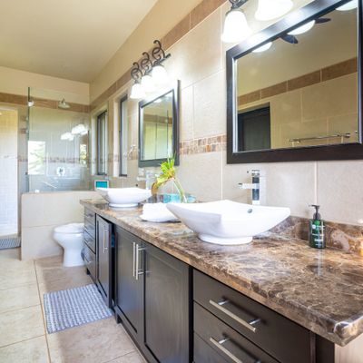 Master bedroom full bathroom with double sinks, indoor and outdoor shower