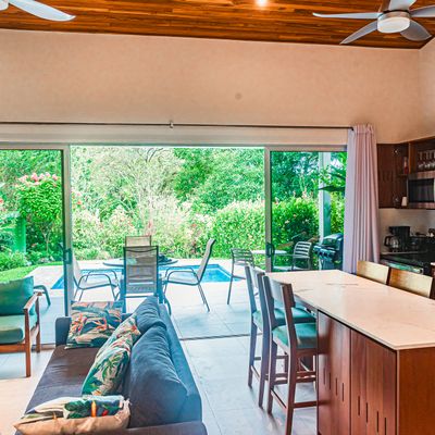 Open-plan design creating a seamless flow between the living room and kitchen.