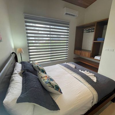 Beautiful bedroom #2 with a queen bed, AC and ceiling fan.