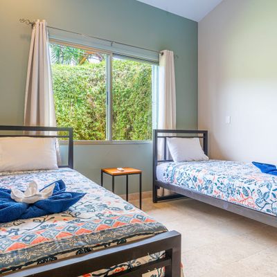 Bedroom #3 has two single beds.