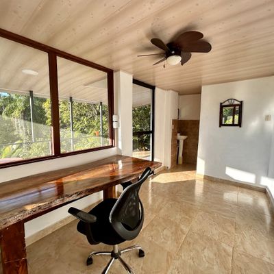 The large office also has a bathroom.