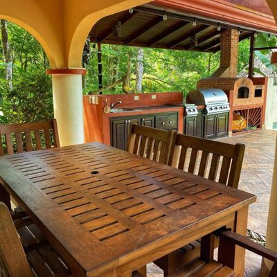well-equipped barbecue space for cooking and entertaining outdoors.