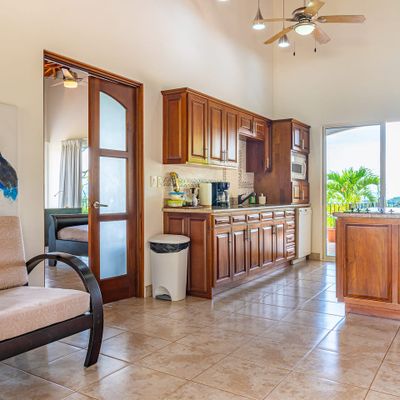An expansive kitchen with a direct view of the sparkling pool.