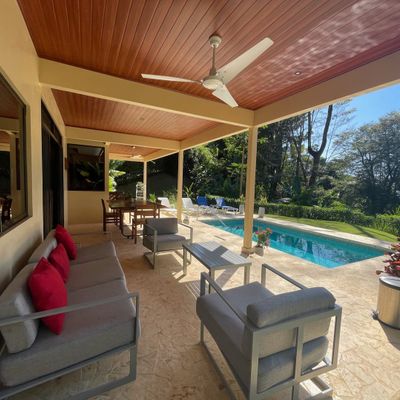 spacious lounge area with direct access to the pool, perfect for relaxation.