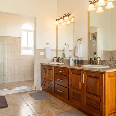 modern bathroom with dual sinks and mirrors, combining functionality and style.