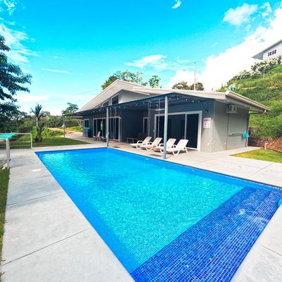 A beautiful house featuring a private pool, creating a serene oasis for relaxation.