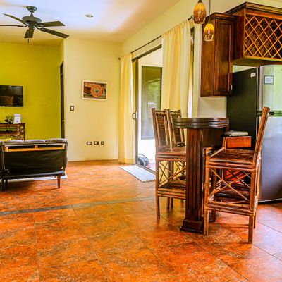cozy kitchen features warm tones and functional design, creating a welcoming space to cook and gather