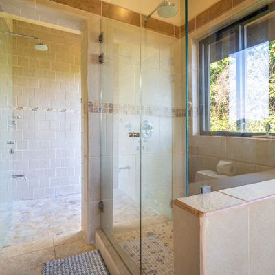 Master bedroom full bathroom with double sinks, indoor and outdoor shower