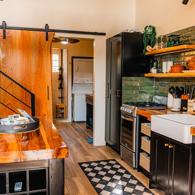 A stylish, well-appointed kitchen with a harmonious mix of textures and sleek design.