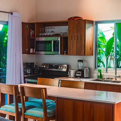 Contemporary kitchen with island seating and modern appliances.