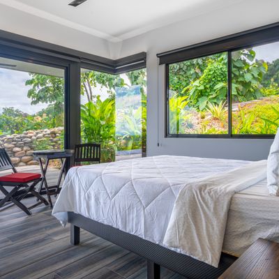 In-suite master bedroom has private access to the swimming pool and patio