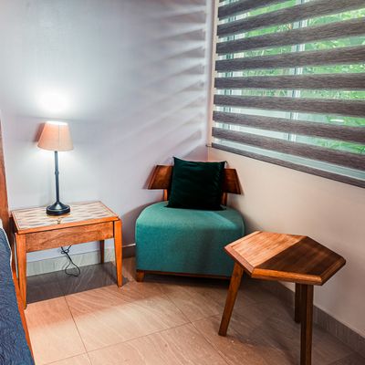 Cozy reading nook by the window, perfect for quiet moments.