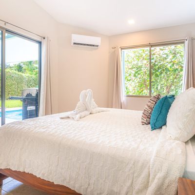 Owner's Suite has en-suite private bathroom and access to the patio and private pool (A/C and ceiling fan also)
