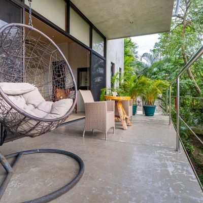 calming space to appreciate the outdoors, surrounded by lush greenery and fresh air.