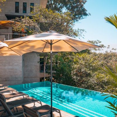 Private pool with outdoor bar area.