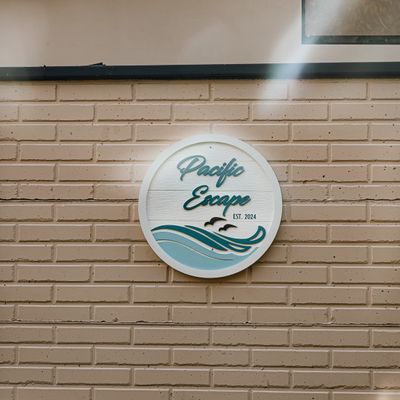 A decorative metal sign with the house’s name, subtly enhancing the entrance's charm.