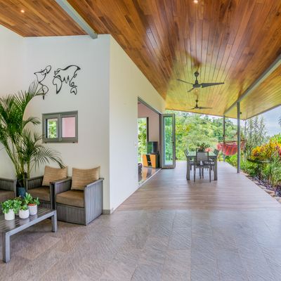 A cozy seating area next to the pool, perfect for relaxing and enjoying the view.