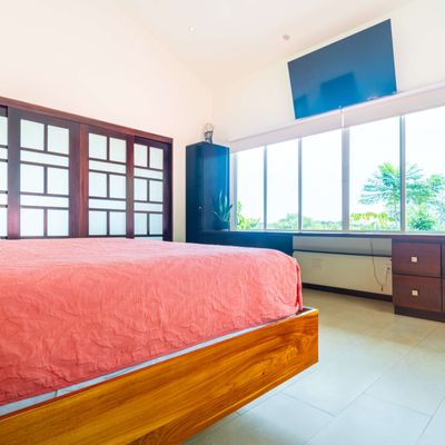 Owner's Suite is spacious, has a king-size bed, A/C, TV, en-suite/private bathroom.