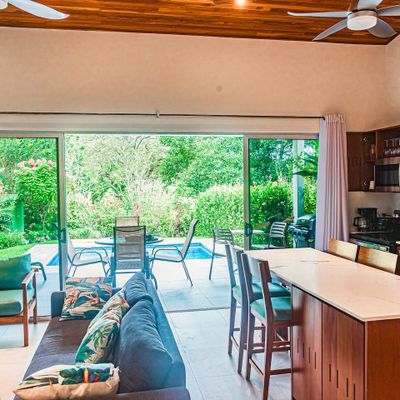 Open-plan design creating a seamless flow between the living room and kitchen.