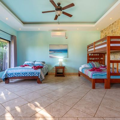 Third bedroom has 2 queen side beds and a single bed in bunk