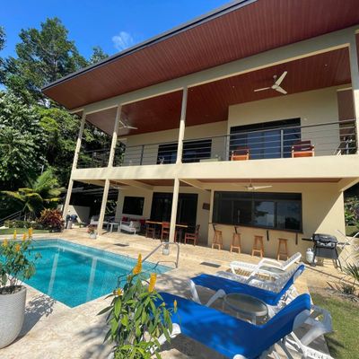 Spacious, comfortable poolside chairs, perfect for lounging and sunbathing.