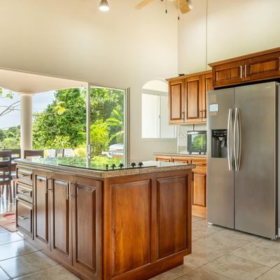 A bright and airy kitchen, combining modern design with a cozy, welcoming atmosphere.